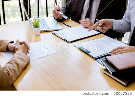 Two selection committee manager reading a resume Two selection committee manager reading a resume 50037539