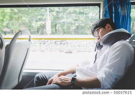 Young Asian man traveler sitting on a bus and 50037615