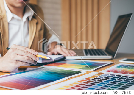 Creative graphic designer using graphics tablet to Creative graphic designer using graphics tablet to 50037638