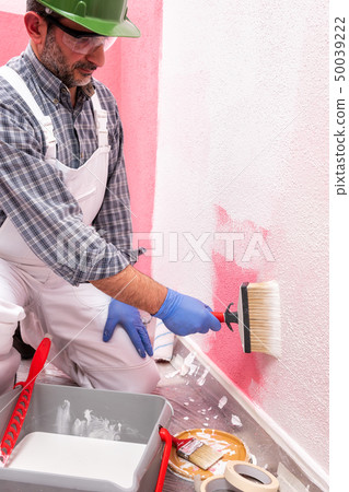 House painter worker at work in the construction House painter worker at work in the construction 50039222