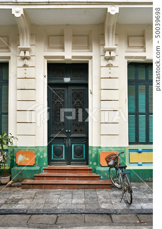 Colorful exterior of old house with vintage doors and windows 50039698