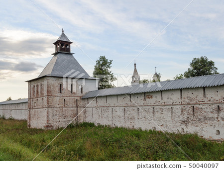 Wall and tower of ancient Russian monastery 50040097