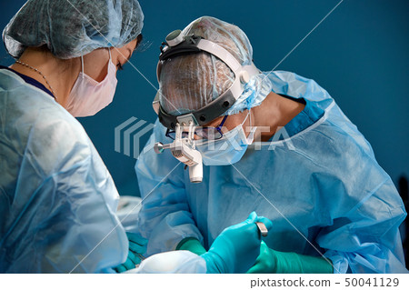 Doctor and assistant nurse operating for rescue patient from dangerous emergency case. Hospital and 50041129