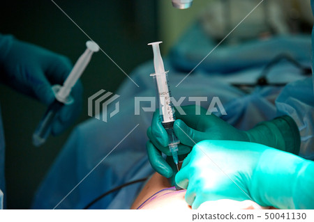 Close up of an operation in operating theater Close up of an operation in operating theater 50041130