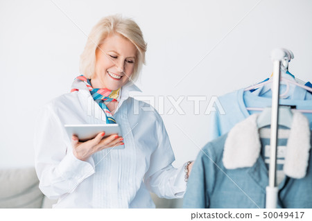 successful seniority lady tablet fashion business successful seniority lady tablet fashion business 50049417