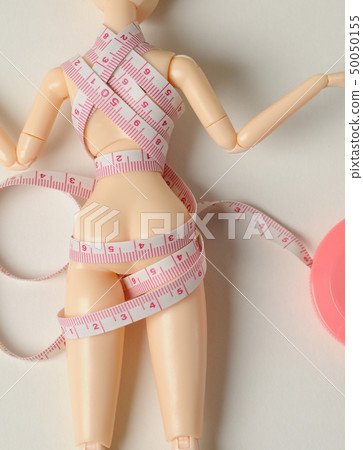 Doll and tape measure 50050155