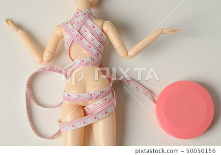 Doll and tape measure 50050156
