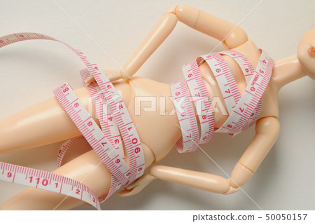 Doll and tape measure 50050157