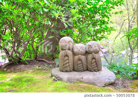 Stone statue of smiling Jizo, Kamakura, Japan 50053078