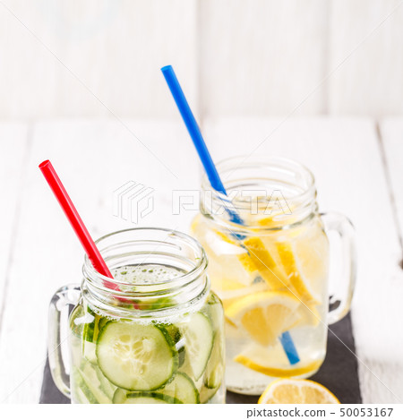 Two mugs of infused detox diet refreshing waters: with cucumber and lemon 50053167