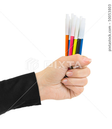 Hand with multicolored pens 50053803
