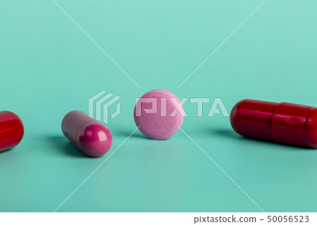 Red and pink medicinal tablets and capsules Red and pink medicinal tablets and capsules 50056523