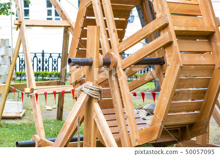 Ancient catapult close up. Defensive wall. Catapult in the downtown of the citywith the sea as 50057095