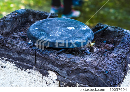 vintage stone tilesfor cooking in nature at the stake 50057694