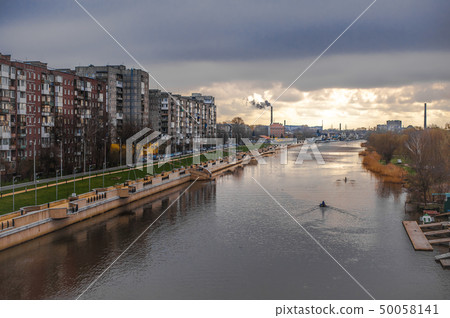 Sunrise. Old residential buildings and the river Sunrise. Old residential buildings and the river 50058141