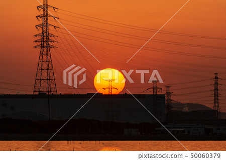Sunset and steel tower 50060379