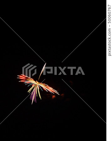 A colorful, one-shot fireworks shaped like a spinning top 50060767