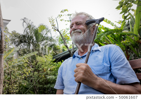 senior man sitting alone and try to remember and 50061607