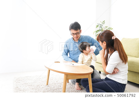 Young couple holding a family meeting Young couple holding a family meeting 50061792