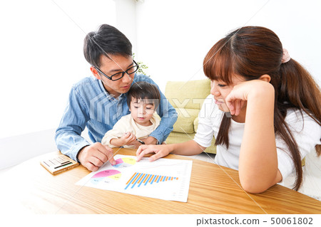 Young couple holding a family meeting Young couple holding a family meeting 50061802