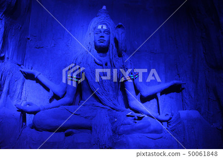 Lord Shiva meditating in a blue light, Pune. Lord Shiva meditating in a blue light, Pune. 50061848