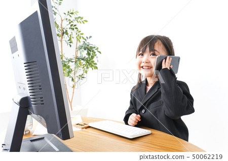 Business woman doing desk work in office Business woman doing desk work in office 50062219