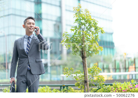 Businessman outdoors Businessman outdoors 50062276