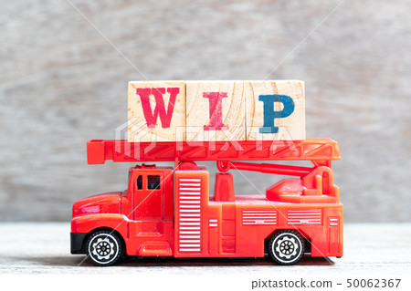 Red fire truck hold letter block in word WIP 50062367