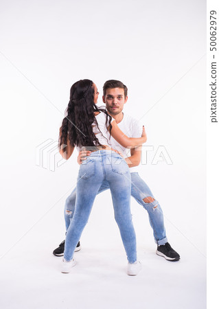 Passionate couple dancing social danse kizomba or bachata or semba or taraxia on white background 50062979