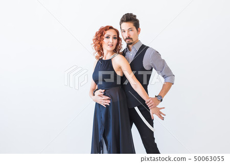 Social dance, kizomba, tango, salsa, people concept - beautiful couple dancing bachata on white 50063055