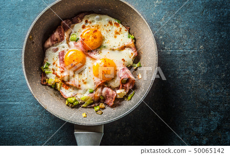 English breakfast fried bacon ham and eggs in English breakfast fried bacon ham and eggs in 50065142