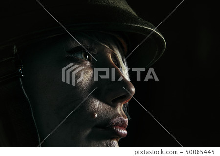 Portrait of young female soldier 50065445