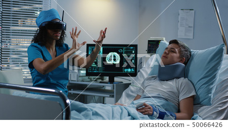 Doctor using VR headset during discussing diagnosis 50066426