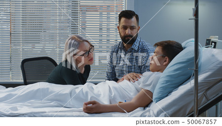 Teenager boy lying in hospital Teenager boy lying in hospital 50067857