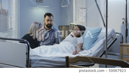 Female patient lying in hospital Female patient lying in hospital 50067923