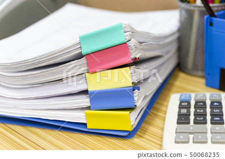 file folder and Stack of business report paper 50068235