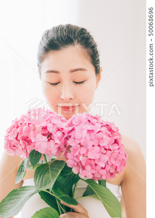 A woman and a hydrangea A woman and a hydrangea 50068696