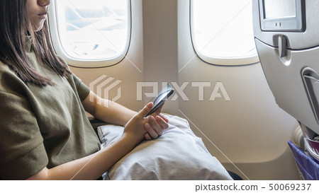 Technology on flight traveling or flying on plane  50069237