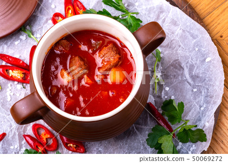 Goulash traditional homemade European beef meat stew soup, Hungarian bograch, close-up, on wooden Goulash traditional homemade European beef meat stew soup, Hungarian bograch, close-up, on wooden 50069272