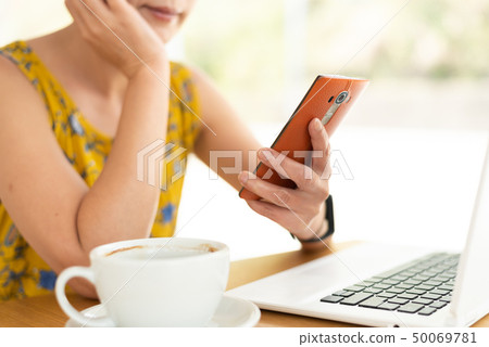 woman working and using cellphone 50069781