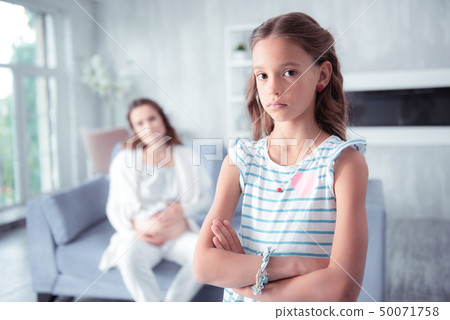 Dark-eyed daughter having no wish to talk to her pregnant mother Dark-eyed daughter having no wish to talk to her pregnant mother 50071758