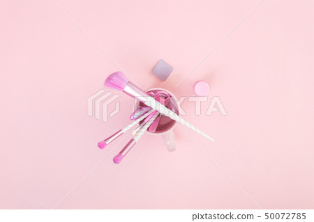 Three unicorn makeup brushes on silver pink Three unicorn makeup brushes on silver pink 50072785