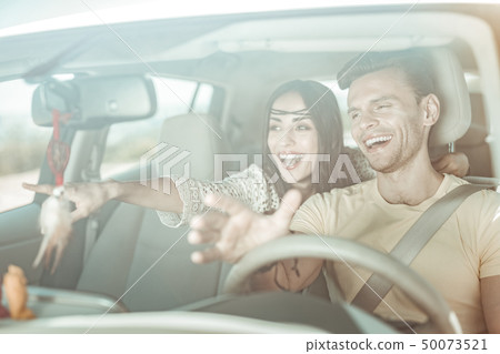 Cheerful young people looking in one direction 50073521