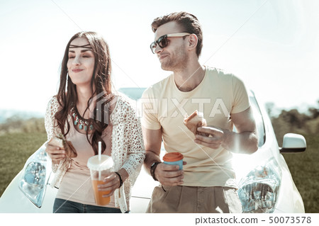 Cheerful young people enjoying their food on nature Cheerful young people enjoying their food on nature 50073578