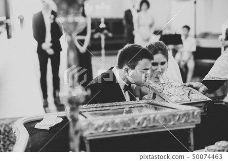 Wedding couple bide and groom get married in a church 50074463