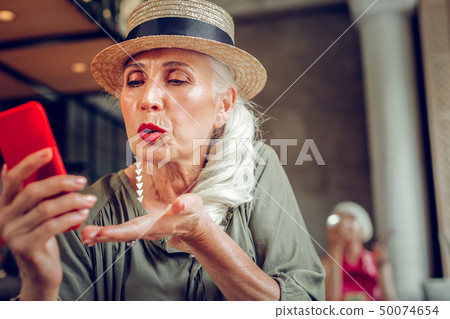 Nice good looking woman sending a kiss Nice good looking woman sending a kiss 50074654