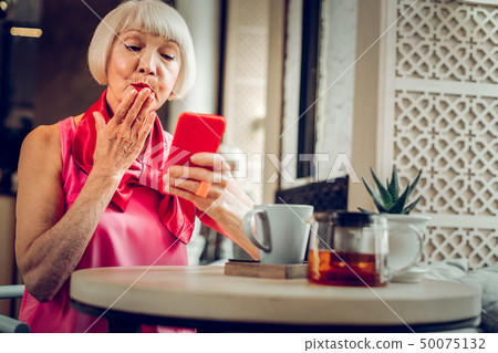 Nice happy woman sending an air kiss 50075132