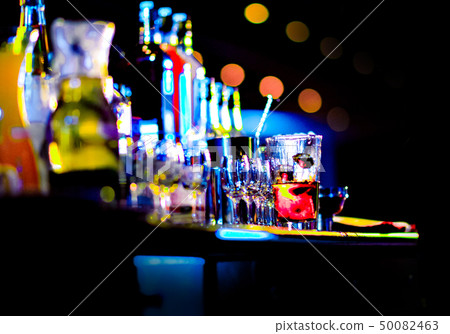Bartender making alcohol cocktail at bar counter 50082463