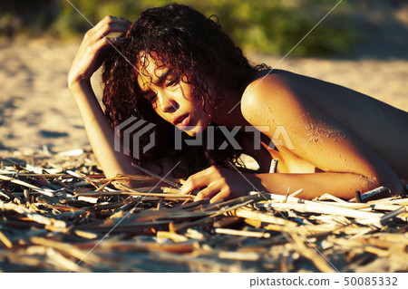 young pretty african curly girl on sunset on beach sexy looking, lifestyle people concept 50085332