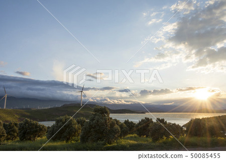Electric wind generator turbine at sunset wind Electric wind generator turbine at sunset wind 50085455